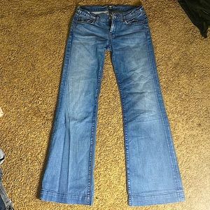 The brand is “7”, low waist bell bottom